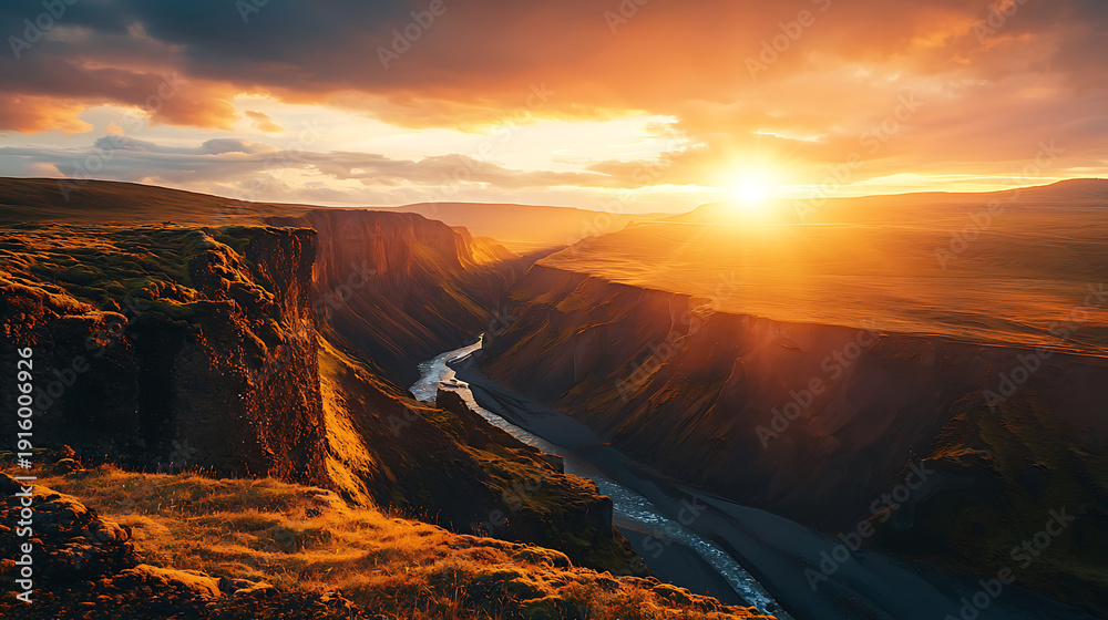 Fototapeta premium Majestic sunset over rugged canyon landscape with winding river.