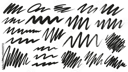 Array of various black hand-drawn scribbles and zig-zag lines with a textured brush feel on a white background.