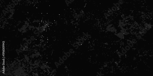 Dark abstract texture with a grainy spotted and uneven black background