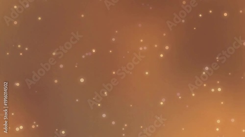 Aerial view of abstract bokeh lights in a warm golden environment, creating a mesmerizing display of light and texture in a video format.