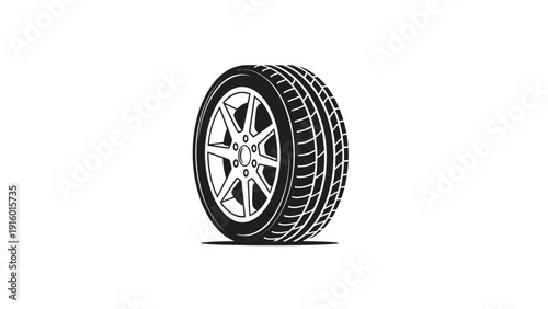 A sleek car tire with a silver rim set against a clean white background with a focus on automotive design.
