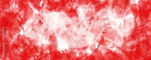 Abstract red watercolor background with soft white center and textured paint splashes. Vibrant crimson and scarlet tones blend organically, creating a dynamic artistic backdrop