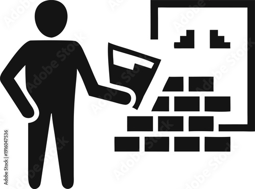 Mason standing beside a partially built brick wall structure with a construction tool