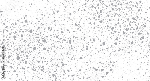 Abstract speckled pattern with varying dot sizes and densities.