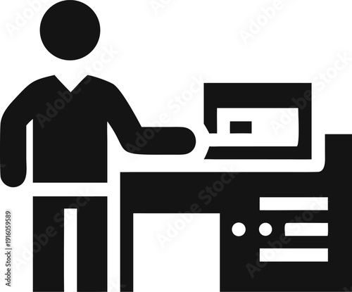 Office worker interacting with a desktop computer at a productive workstation
