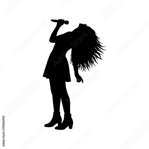 Silhouette of a female singer performing on stage with microphone.