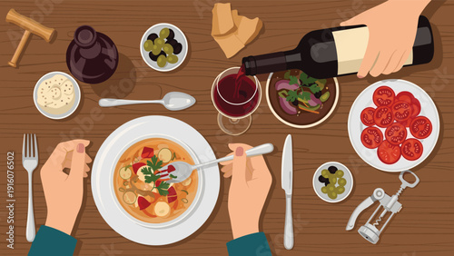 Overhead view of a dining table with various mediterranean dishes, wine, and hands using cutlery to enjoy a bowl of vegetable soup.