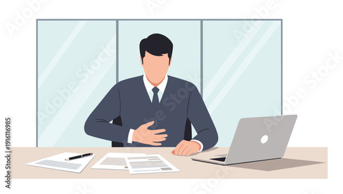 Business professional sitting at desk feeling unwell in modern office environment