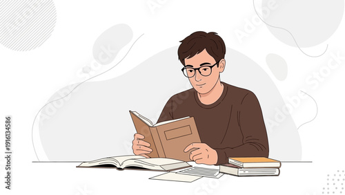 Young Man Reading Book at Desk with Study Materials