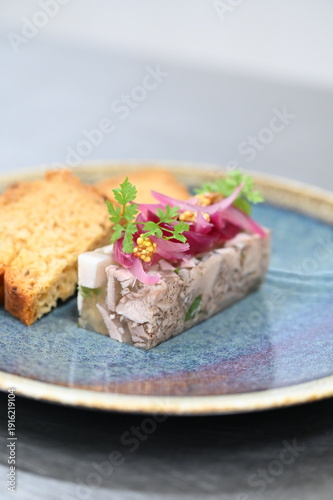 Quadro su tela Aspic terrine made from pork knuckle, traditional Czech head cheese style dish, served in a restaurant setting
