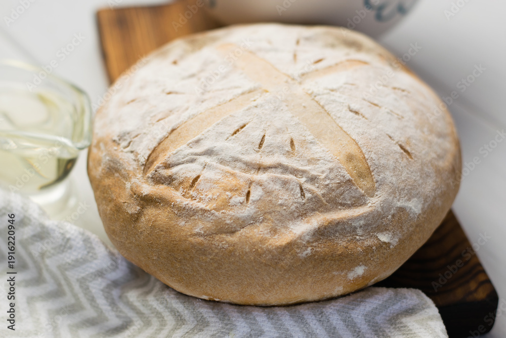 Fototapeta premium Appetizing homemade bread pastries on light background close-up