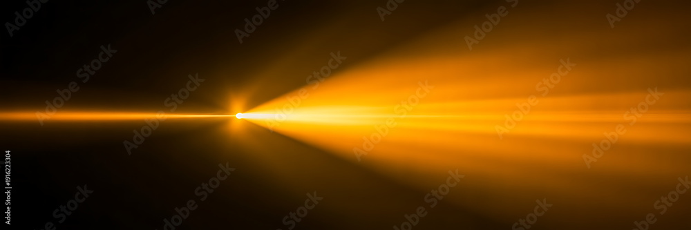 Fototapeta premium Bright Orange Lens Flare Effect - Dynamic Light Rays on Dark Background for Overlay or Abstract Design