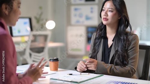 Businesswomen having a conversation in the office