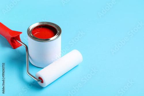 Roller with can of red pain...