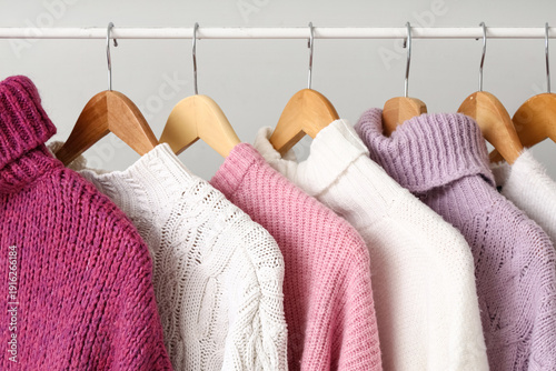 Rack with knitted sweaters ...