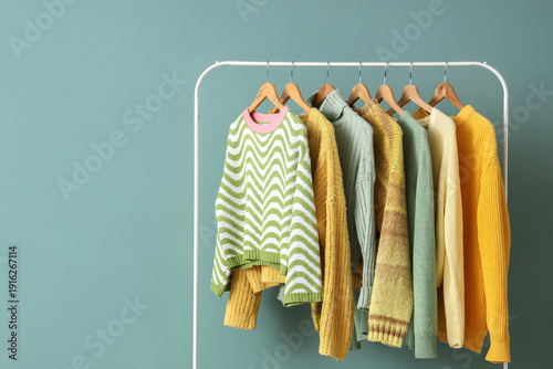 Rack with knitted sweaters ...