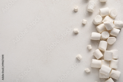 Many sweet marshmallows on ...