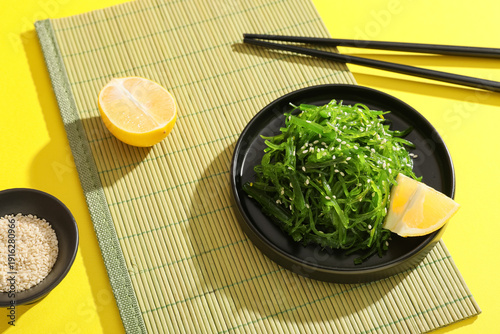 Plate with seaweed salad, s...