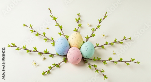 Colorful easter eggs on blooming spring branches pastel colors festive holiday decoration
