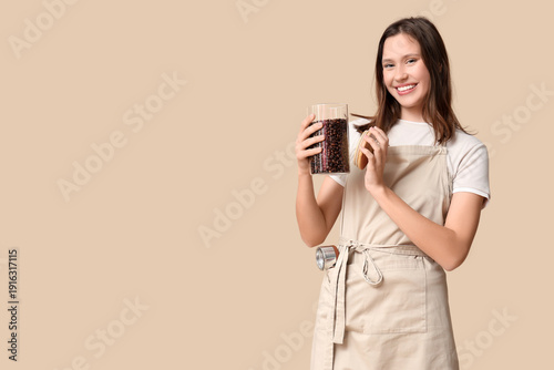 Happy young female barista ...