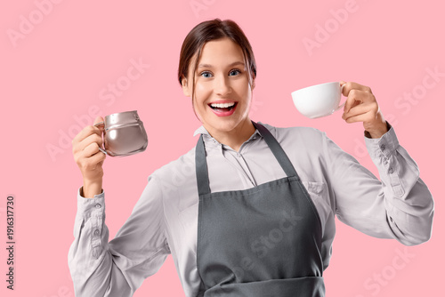 Happy young female barista ...