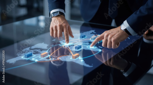 Executives interact with a smart logistics map to plan global routes using a digital touchscreen.