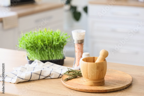 Wooden mortar with pestle a...