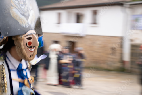 Galician Felos wearing traditional costumes in the Entroido Folkloric Carnival in the streets of a Galician Village
