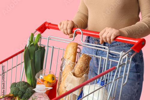 Woman with shopping cart fu...