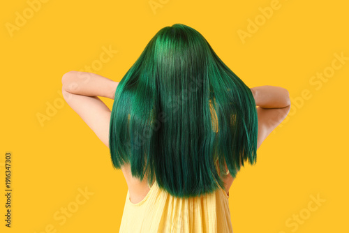 Young woman with green hair...