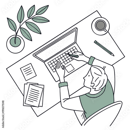 A woman works on her laptop at a desk