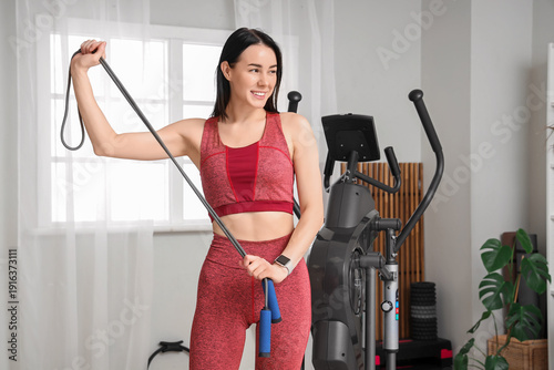 Sporty young woman with ski...