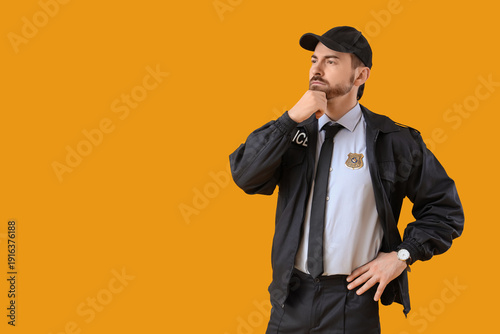 Thoughtful male police offi...