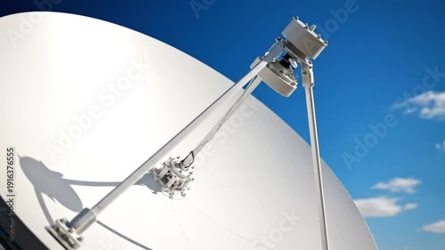 Satellite dish rotating against sky