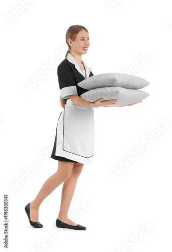 Pretty chambermaid with pil...