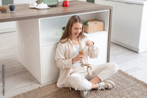 Young woman with jar of pea...