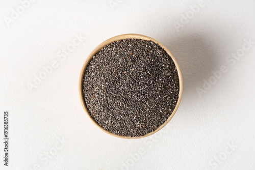 Bowl with chia seeds on whi...