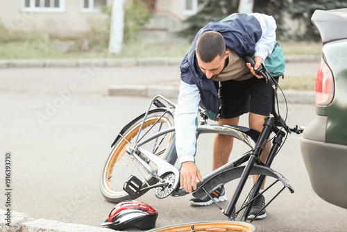 Young male cyclist crashed ...