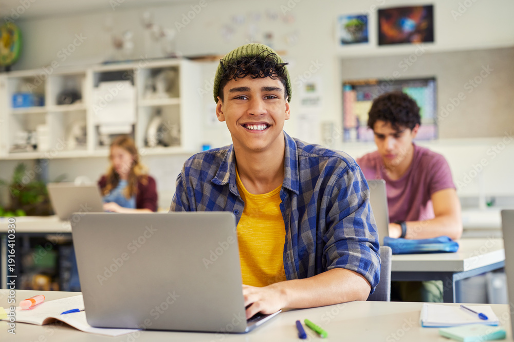 © Rido - Portrait of smiling student in classroom at secondary school