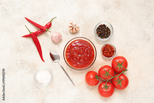 Glass bowl of chili sauce a...
