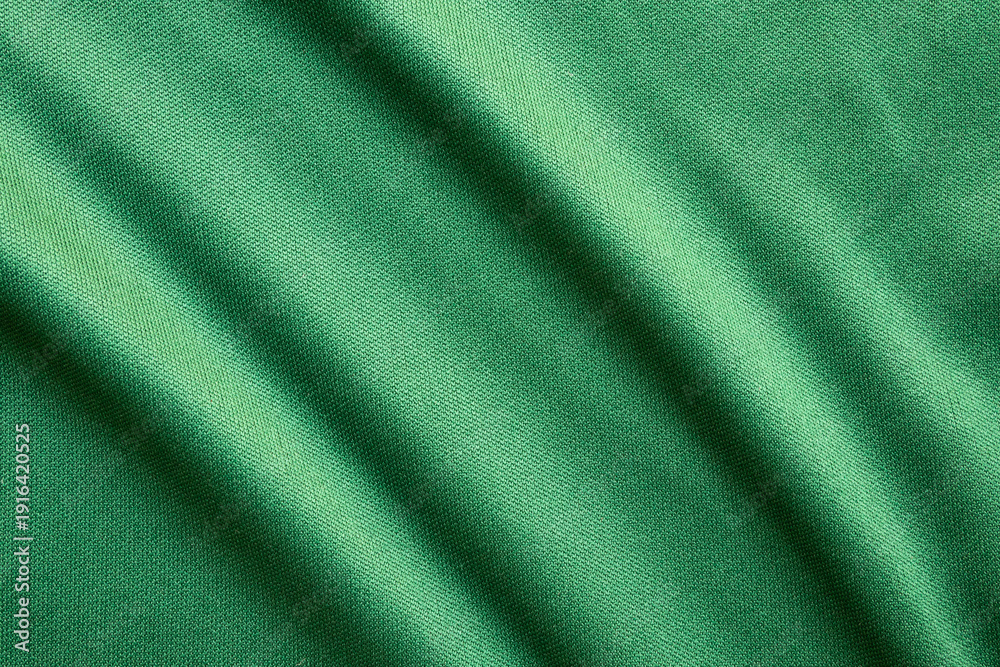 Fototapeta premium Green sports clothing fabric football shirt jersey texture close up