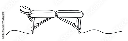 Continuous line drawing of a professional massage table or spa couch for wellness and relaxation therapy in a modern health salon or medical center