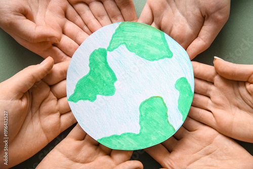 Hands holding paper planet ...
