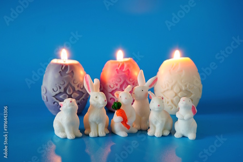 Wallpaper Mural Figures of toy rabbits and burning Easter candles. Torontodigital.ca