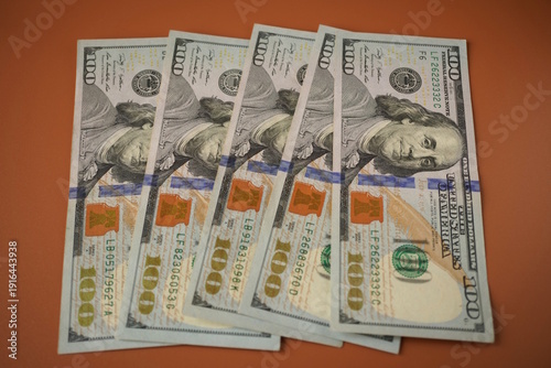 Wallpaper Mural There are several dollar bills on the table. Torontodigital.ca