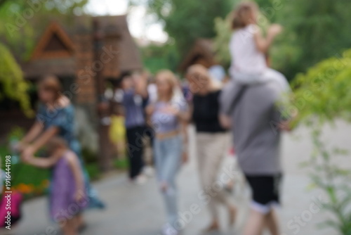 Wallpaper Mural Blurred background. People are walking in the city park. Torontodigital.ca