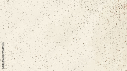 Close-up of a textured, light beige surface resembling sand or fine grit.