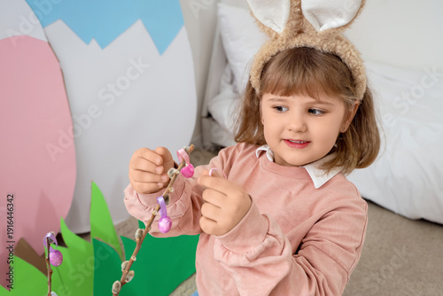 Cute little girl decorating...