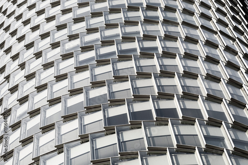 Modern urban architecture facade with curved pattern texture and repetition in detailed abstract background design for creative projects
