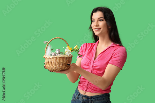 Pretty young woman holding ...